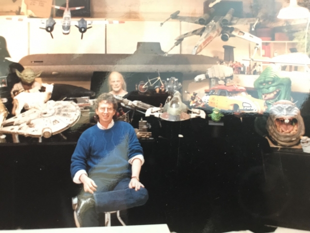 Ross, while GM at ILM, sitting in front of models and miniatures the studio created, for a piece promoting a TV appearance with Diane Sawyer.